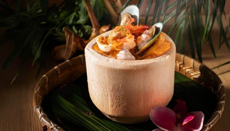 Experience Authentic Thai Flavours with Steamed Seafood Curry Custard in Young Coconut - TRAVELINDEX